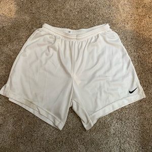 Womens white Nike soccer shorts.